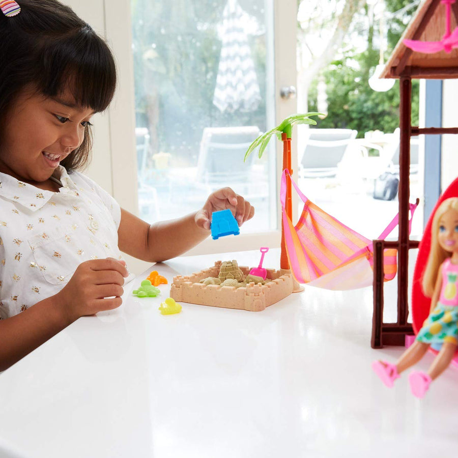 Barbie Chelsea Doll and Tiki Hut Playset with 6-inch Blonde Doll, Hut with Swing, Hammock, Moldable Sand, 4 Molds and 4 Storytelling Pieces, Gift for 3 to 7 Year Olds [Amazon Exclusive]