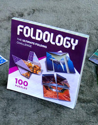 Foldology - The Origami Puzzle Game! Hands-On Brain Teasers for Tweens, Teens & Adults. Fold the Paper to Complete the Picture. 100 Challenges from Easy to Expert. Ages 10+
