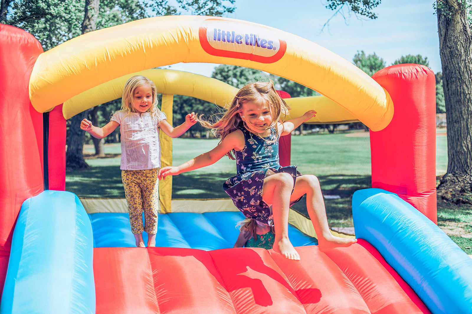 Little Tikes Jump 'n Slide Bouncer - Inflatable Jumper Bounce House Plus Heavy Duty Blower With GFCI, Stakes, Repair Patches, And Storage Bag 106.2 Inch x 137.7 Inch x 65.7 Inch Ages 3-8 Years